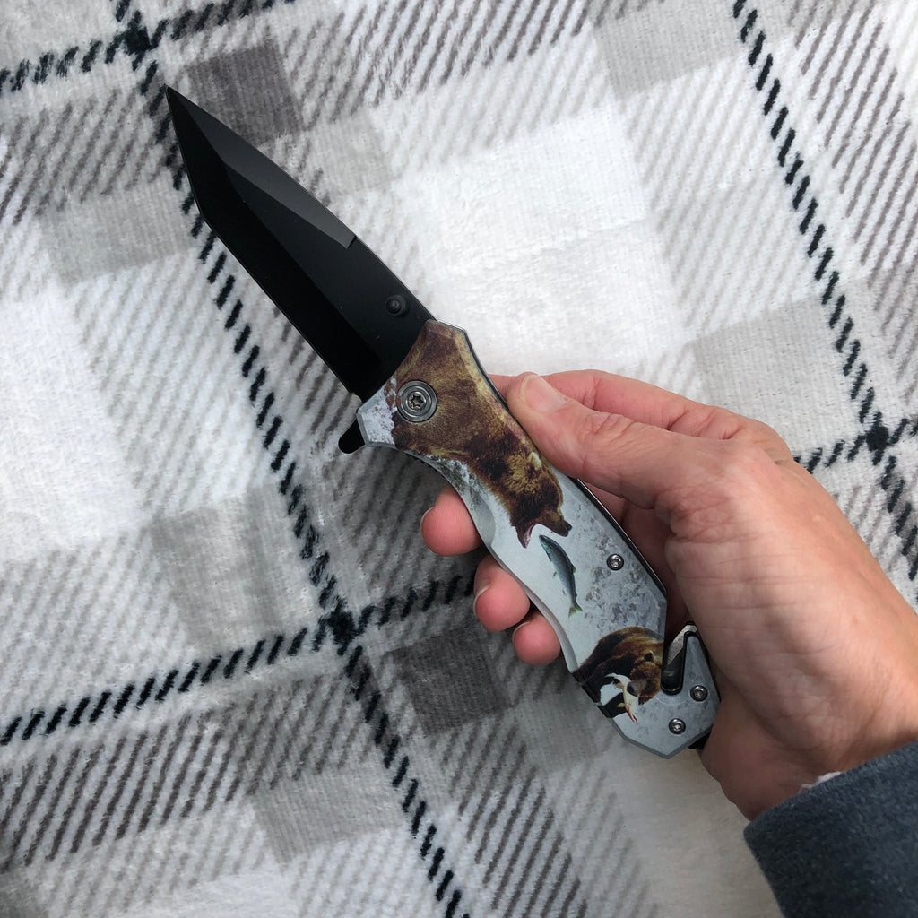 hand holding bear pocket knife 