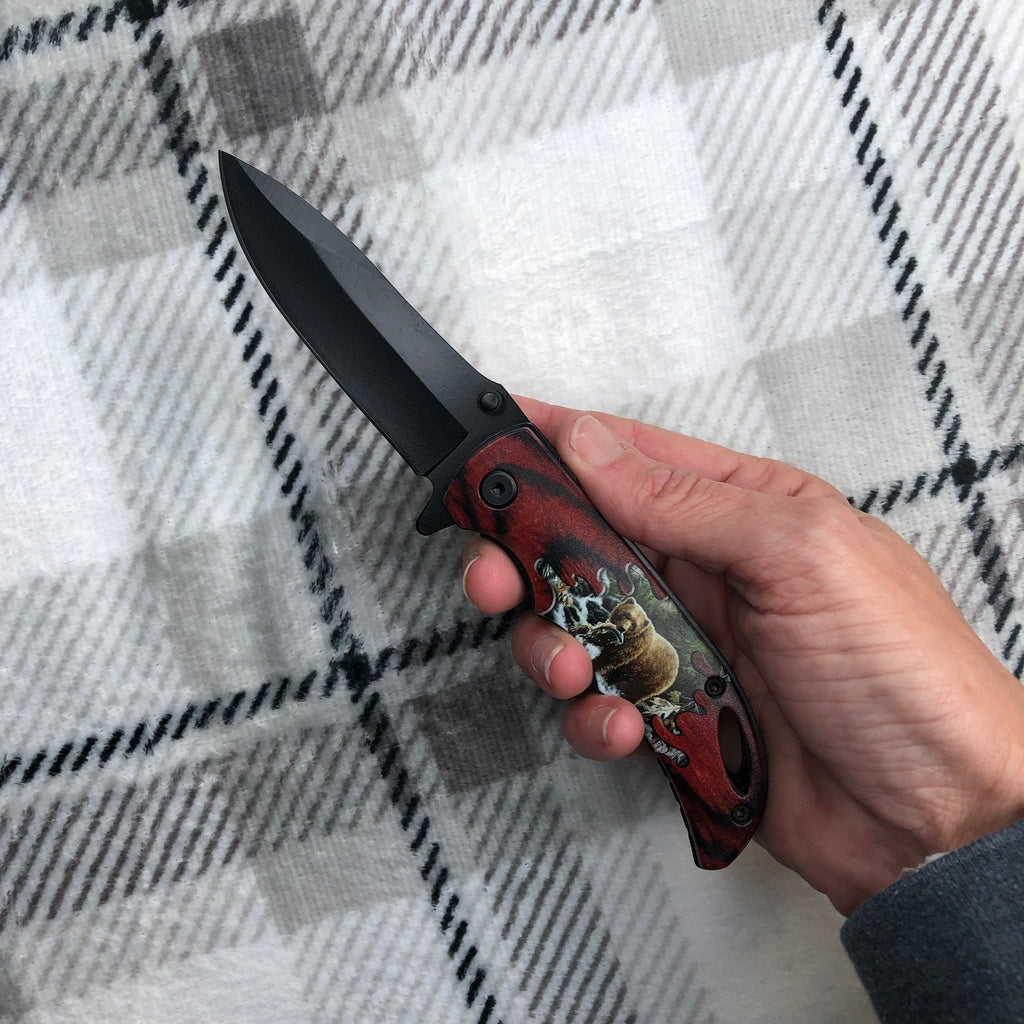 Hand holding bear knife