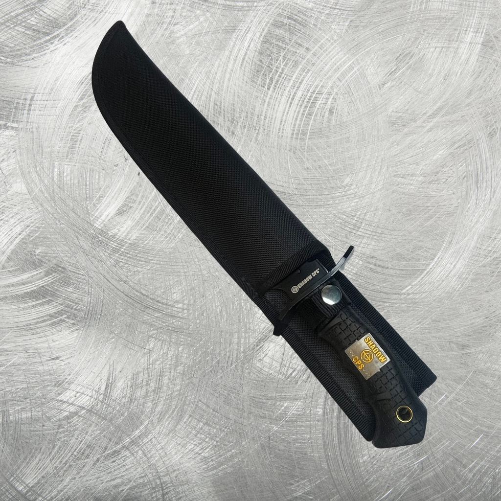  Close-up of the Shadow Ops Tactical Knife's handle, showcasing its textured grip and the Shadow Ops logo