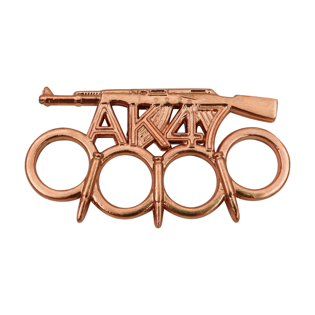 One-of-a-kind brass knuckles featuring a handcrafted AK-47 design with bullet-shaped spikes, perfect for adding an edge to your style.