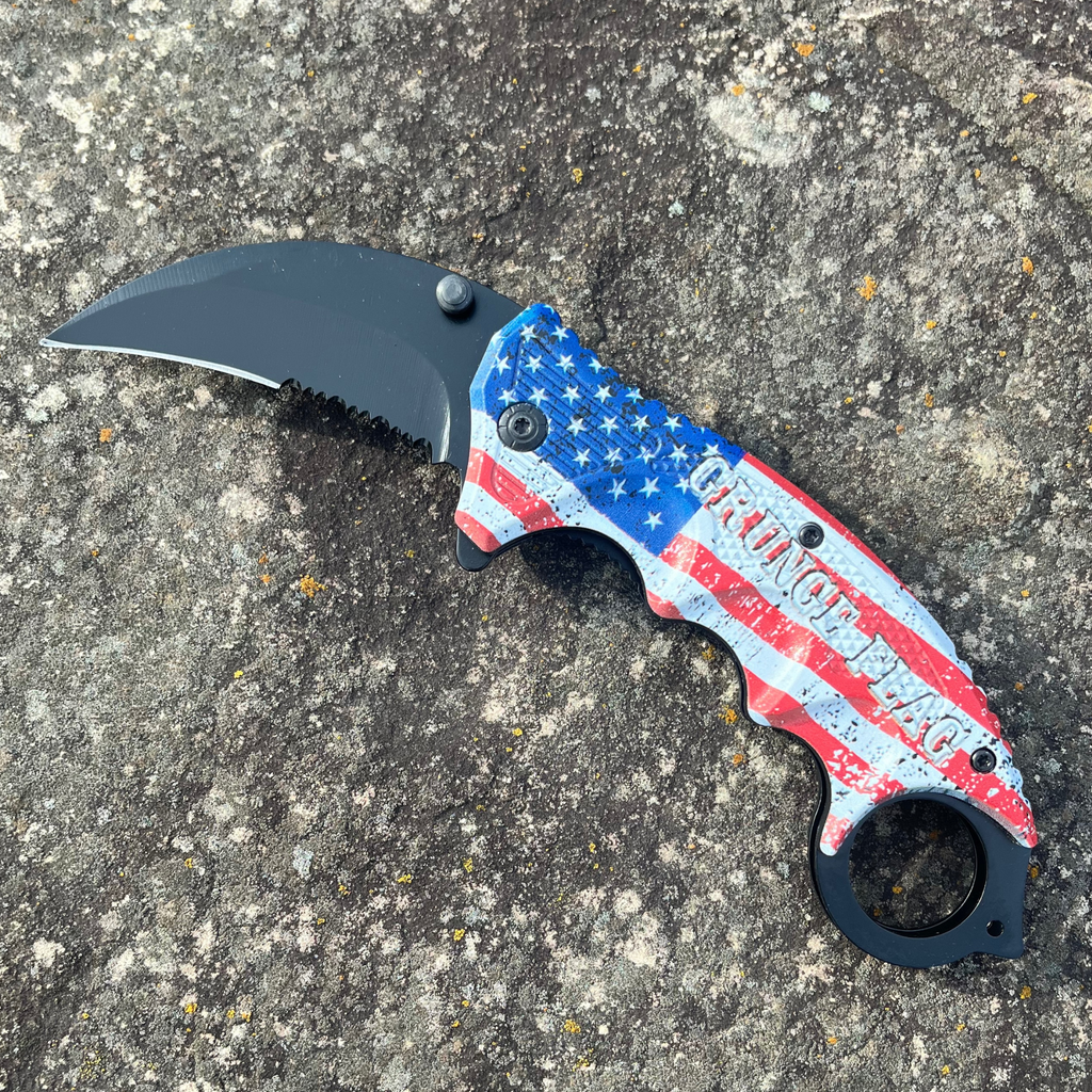 Measuring 7.5 inches in length, this Grunge Flag Karambit folding knife features a 1065 German surgical steel blade, making it an official Tiger-USA® knife. A weighing 4.27 ounces, this knife is heavy duty and spring assisted, yet remains affordable.